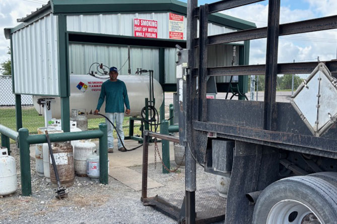 A man refilling a propane tank