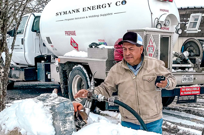 A man filling a propane tank